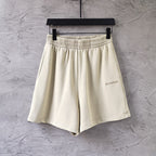 Balenciaga cream shorts with elastic waistband and small side logo
