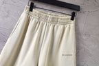 Cream shorts with elastic waistband and small side logo