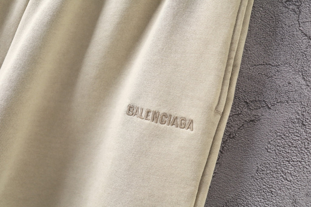 Cream shorts with BALENCIAGA logo on the front leg