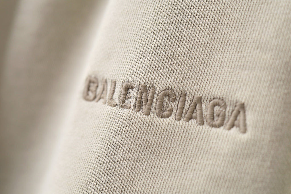 Cream shorts with BALENCIAGA logo embroidery on fabric