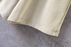 Cream shorts with stitched hem cuff detail