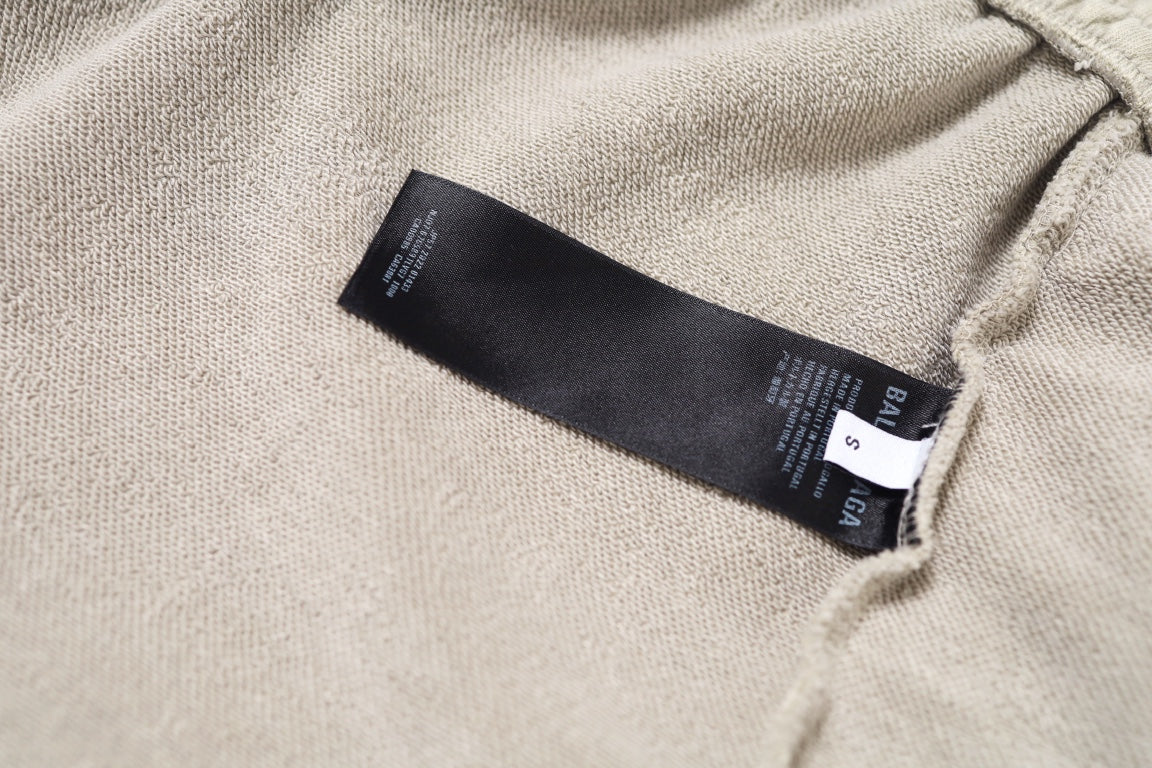 Cream shorts with inside care label on knit fabric