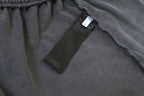 Inside waistband with black label on light gray shorts