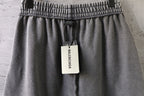 Light gray shorts with elastic waistband and hanging brand tag