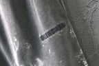 Light gray shorts with Balenciaga logo print on the leg