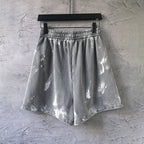Distressed light gray drawstring shorts with elastic waistband