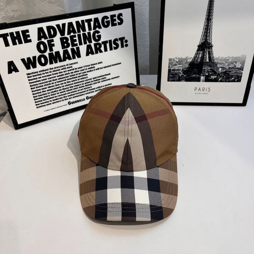 Burberry cap in tan, navy, and white check plaid with curved brim