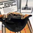 Plaid cap interior with black lining and leather-style adjustable strap