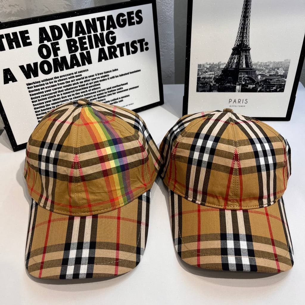 Pair of Burberry tartan plaid baseball caps in tan, black, and red, front views