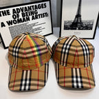 Pair of Burberry tartan plaid baseball caps in tan, black, and red, front views