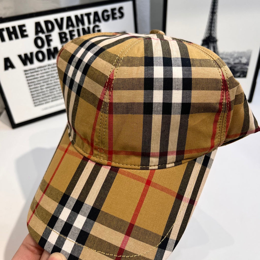 Plaid baseball cap top view with tan, black, and red grid pattern