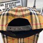 Burberry cap inside front panel with metal snaps and stitched plaid edge