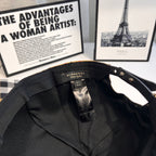 Burberry cap interior lining with size and care label and black strap with grommets