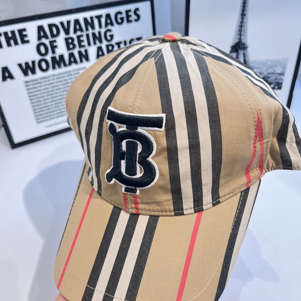Striped baseball cap close-up with navy B logo patch