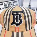 Striped baseball cap close-up of navy B logo patch