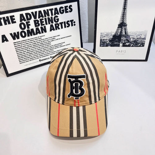 Striped baseball cap with navy B logo patch and curved brim