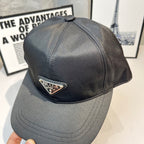 Prada baseball cap in dark gray satin with triangular logo patch on the front