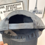 Prada cap interior view showing stitched brim edge and inner lining.