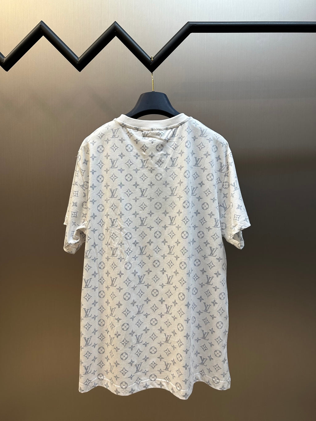Light monogram patterned T-shirt front view with crew neck and short sleeves