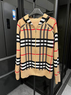 Beige plaid zip-front hoodie with black striped trim and red windowpane lines