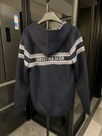 Dior hooded zip jacket with large "CHRISTIAN DIOR" logo stripe across chest