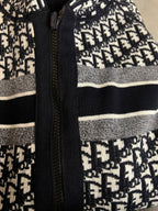 Dior hooded zip jacket close-up of front zipper and logo print side panels