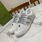 White Gucci unisex sneakers with gray laces and side stripe detail