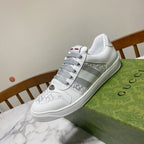 White Gucci unisex sneakers with gray stripe panel and textured sole