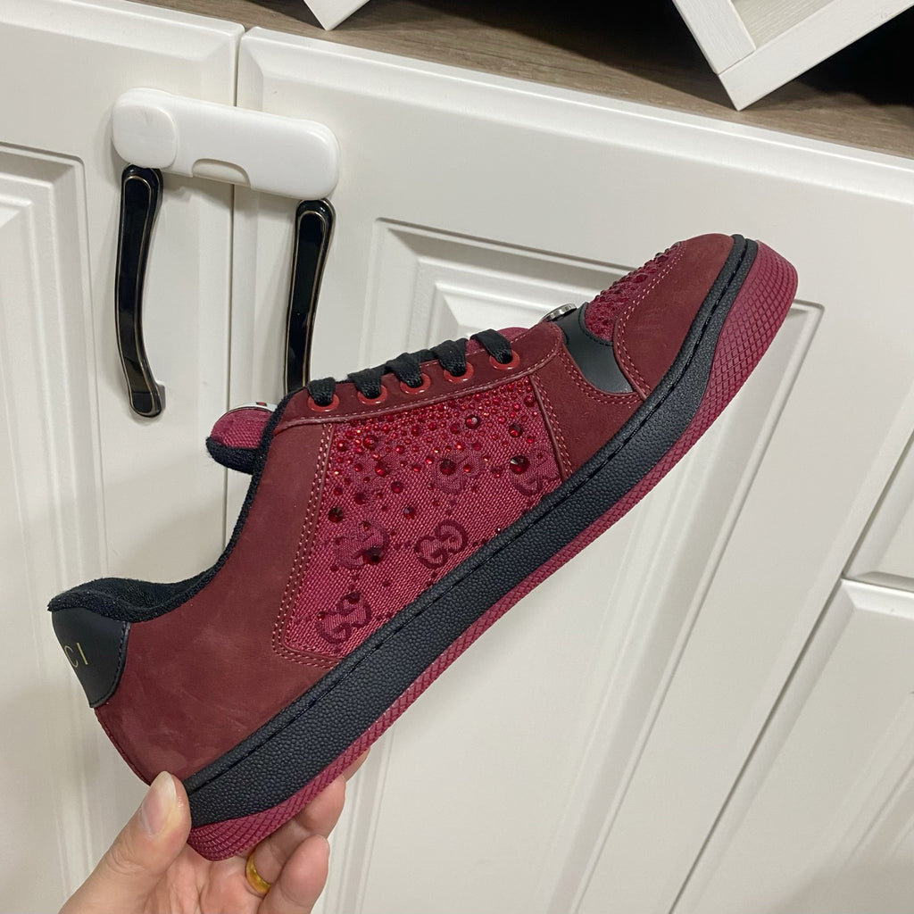 Gucci unisex sneakers held up, burgundy leather with black trim and low-profile sole