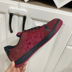 Gucci unisex sneakers held up, burgundy leather with black trim and low-profile sole