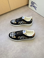 Black and white checkered lace-up sneakers with padded collar and white rubber sole