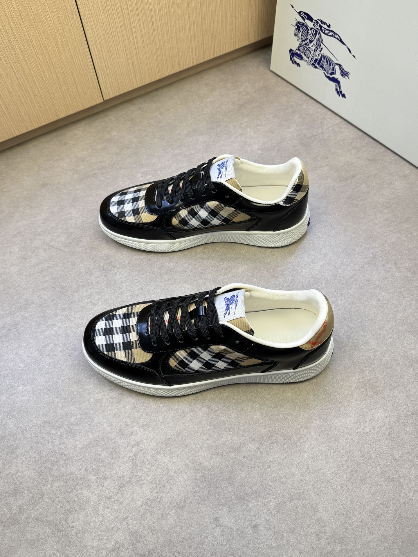 Black and white checkered lace-up sneakers with padded collar and white rubber sole