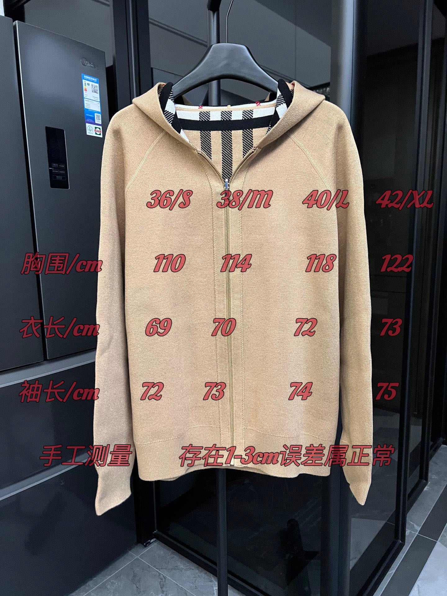 Beige zip-front sweatshirt with red size numbers printed across the front