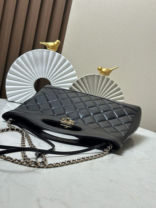 Black quilted shoulder bag with gold-tone chain strap and flap clasp