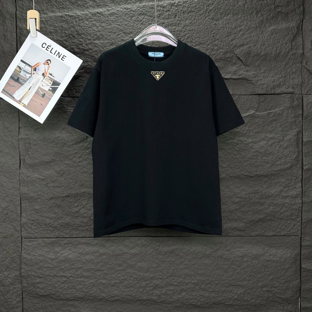 Prada black short-sleeve T-shirt with small gold triangle logo at chest