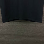 Prada black short-sleeve T-shirt hem and lower front, cropped view