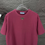 Maroon short-sleeve T-shirt with triangular logo at the chest