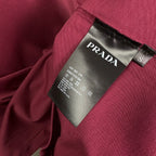 Prada fabric label inside maroon short-sleeve T-shirt collar