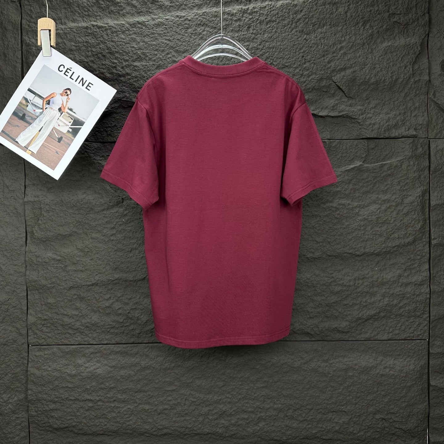 Maroon short-sleeve T-shirt on a hanger, back view