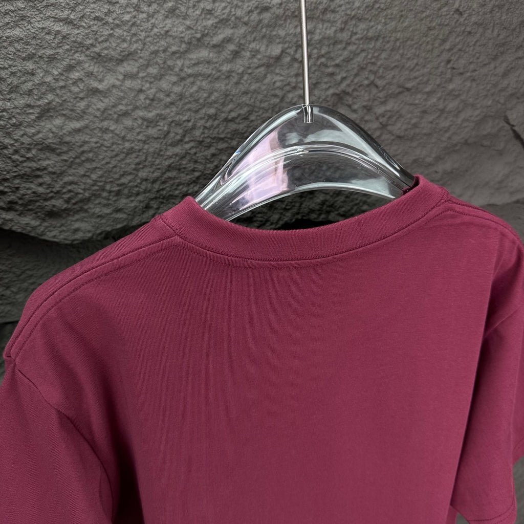 Maroon short-sleeve T-shirt back view on a hanger