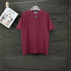 Maroon short-sleeve T-shirt with triangular logo patch on the chest