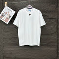 Prada short-sleeve T-shirt in white with small triangle logo on chest