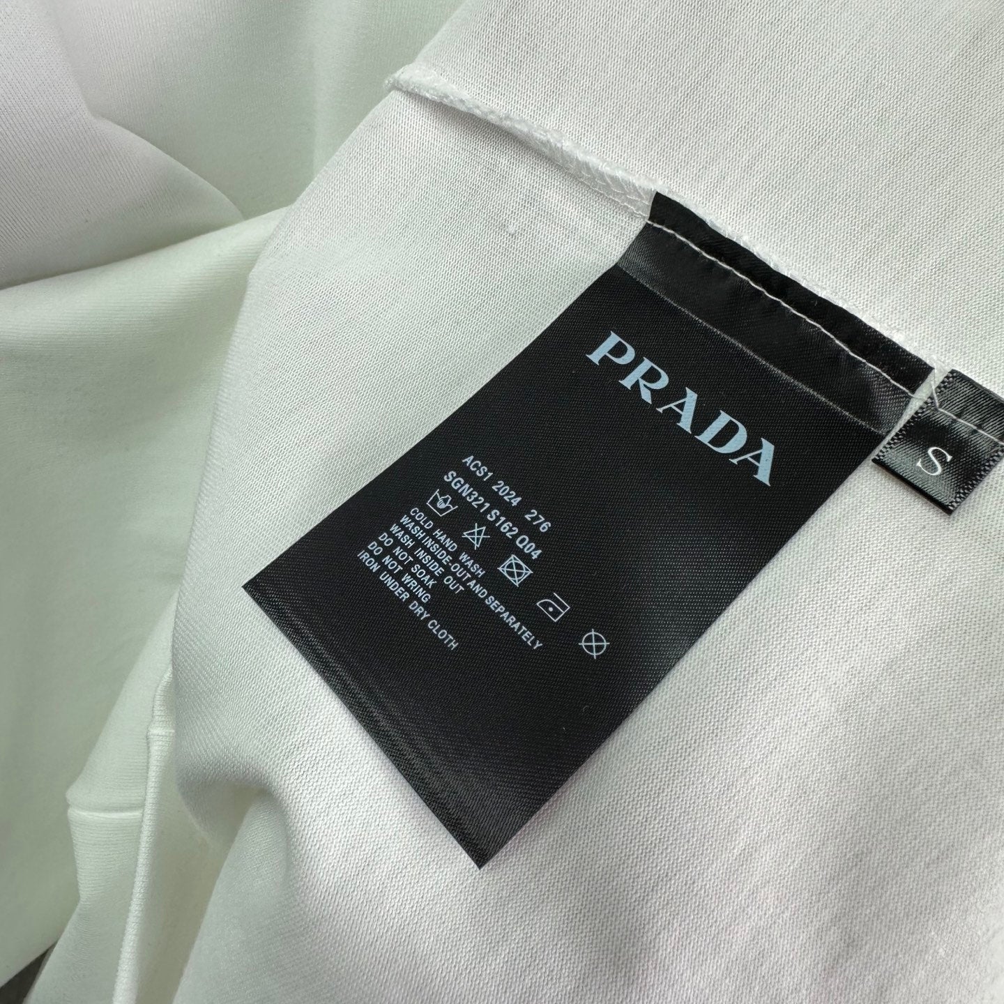 Prada neck label on white short-sleeve T-shirt