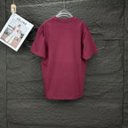 Prada short-sleeve T-shirt in dark berry, shown from the back on a hanger.