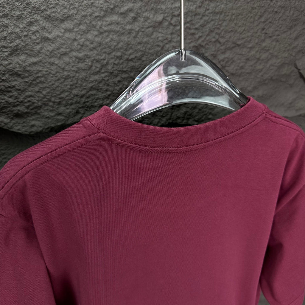 Prada short-sleeve T-shirt back neckline in dark berry on a transparent hanger.