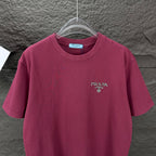 Prada short-sleeve T-shirt in dark berry with PRADA logo on the chest.