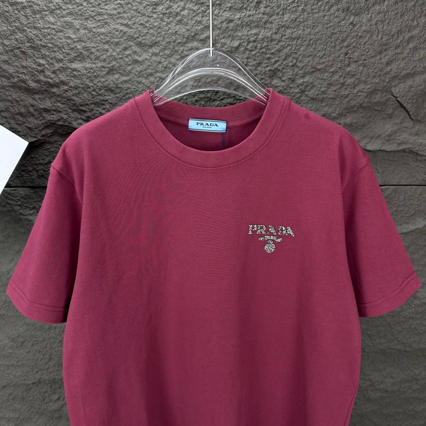 Prada short-sleeve T-shirt in dark berry with PRADA logo on the chest.