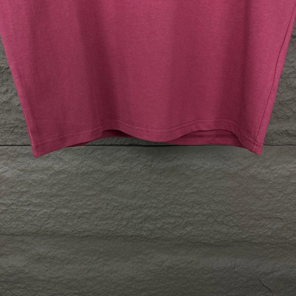 Prada short-sleeve T-shirt hem in dark berry, underside view.