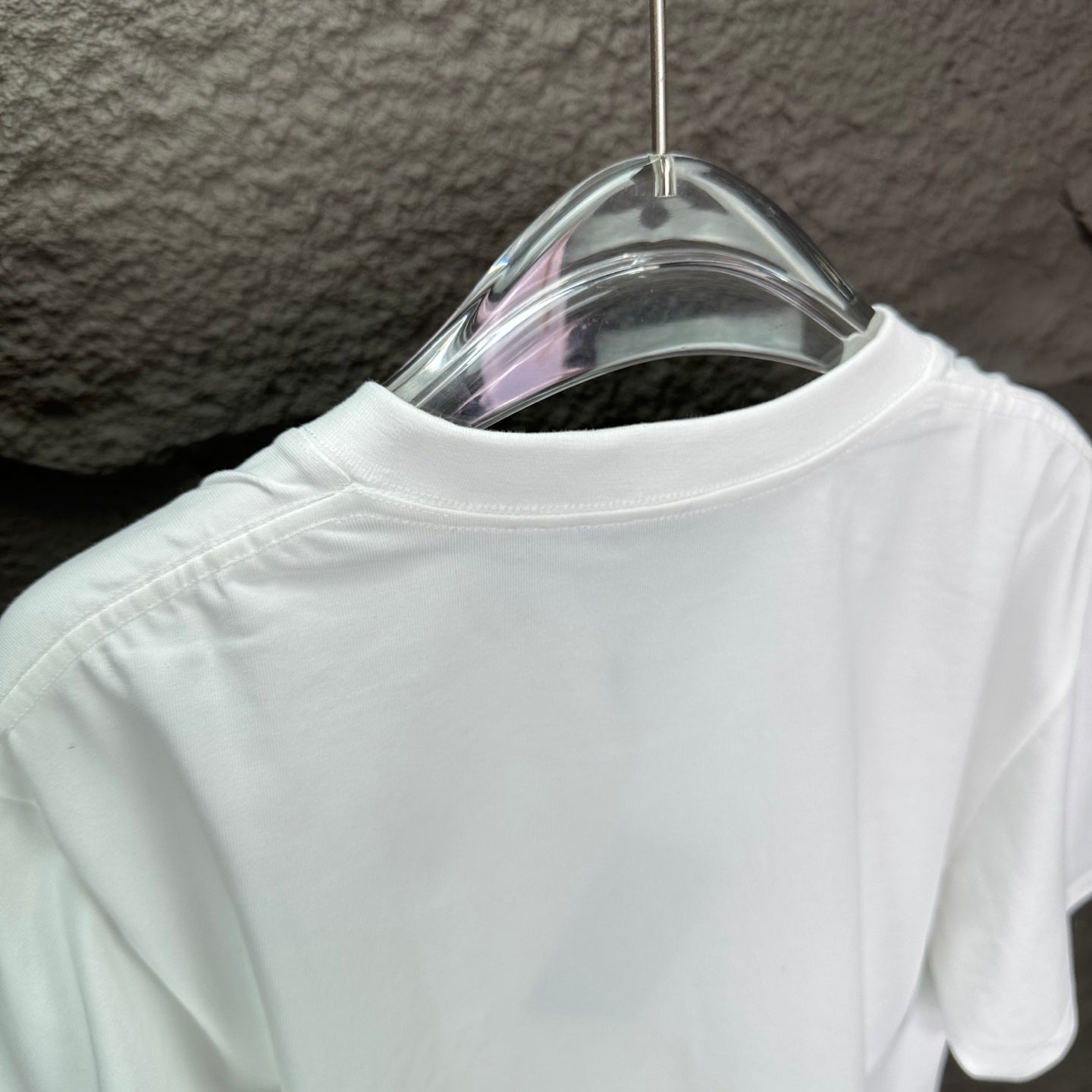 White short-sleeve T-shirt back neckline on hanger
