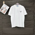 White short-sleeve T-shirt with small PRADA logo on left chest